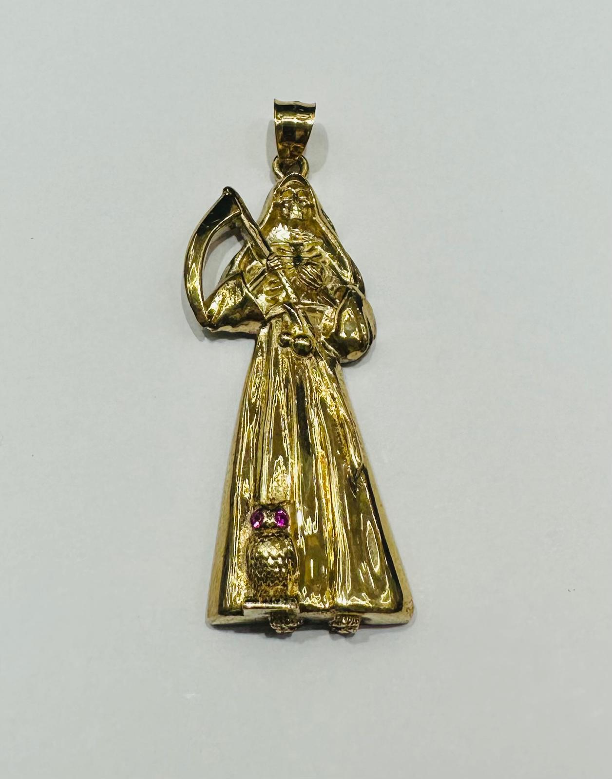 10K GOLD SANTA MUERTE PENDANT WITH SAPPHIRE STONES- WEIGHT: 11.2gm
